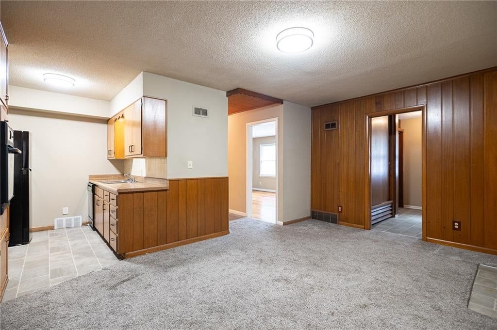 Double oven, breakfast nook and wood kitchen cabinets at 5444 N Cypress Avenue, Kansas City, MO 64119