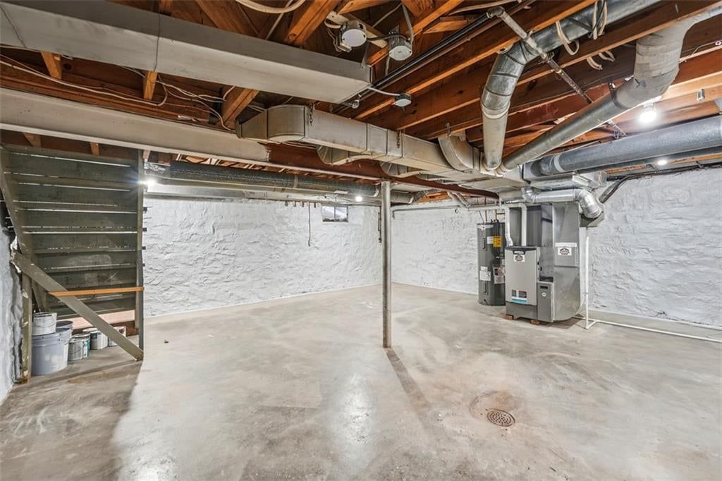 Finished basement and curved staircase at 5416 NE Circle Drive, Kansas City, MO 64119
