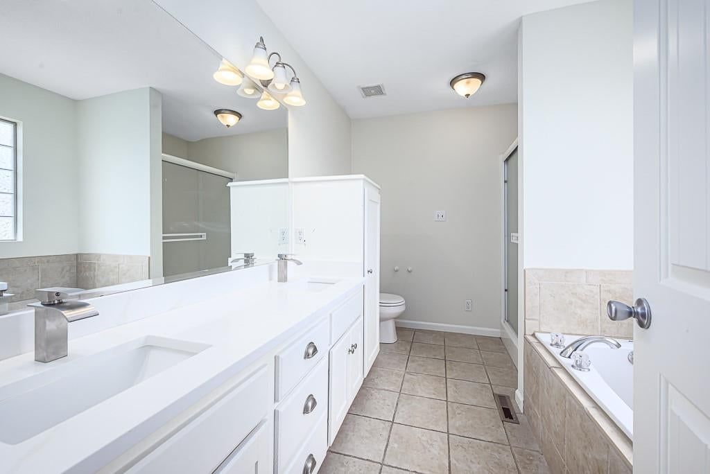 Tile floors, walk-in shower and tiled shower at 2322 Gettysburg Drive, Leavenworth, KS 66048