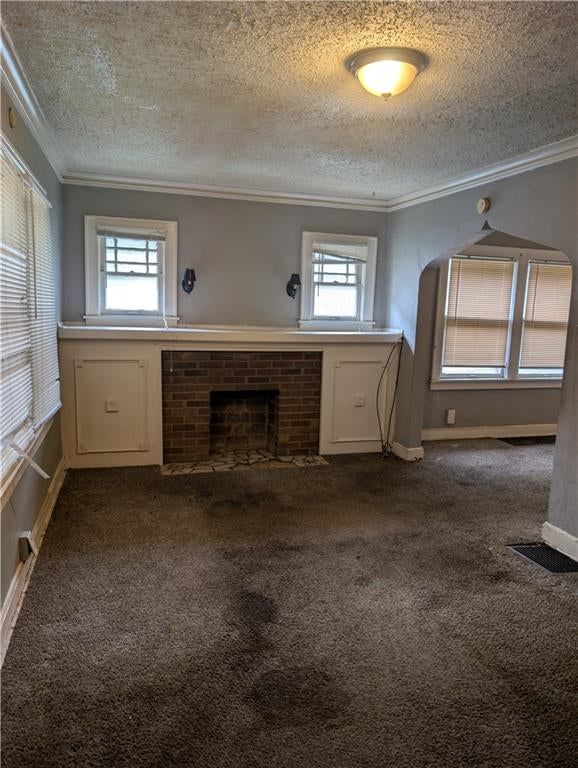 Fireplace, white trim and gray walls at 3030 Bales Avenue, Kansas City, MO 64128