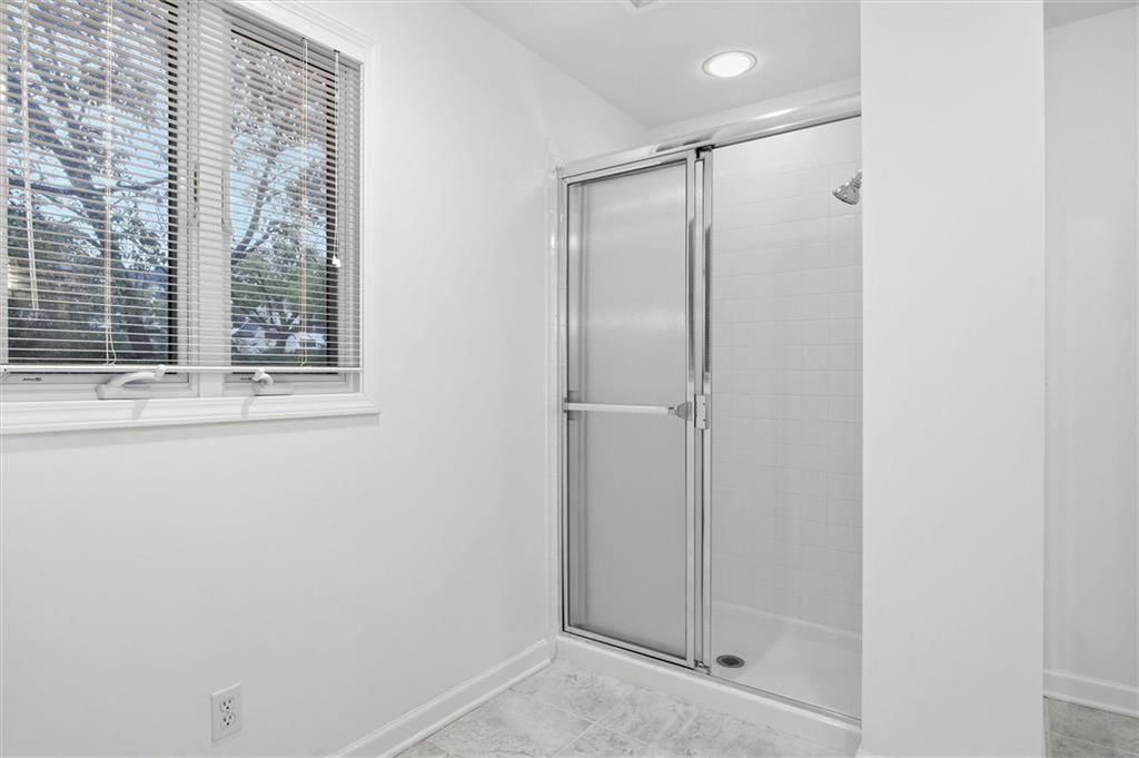 Tiled shower at 4124 Brookridge Drive, Fairway, KS 66205