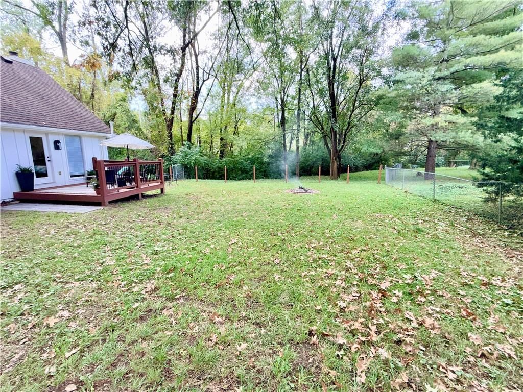Big backyard, fenced yard and fire pit at 12100 59 Street, Kansas City, MO 64133