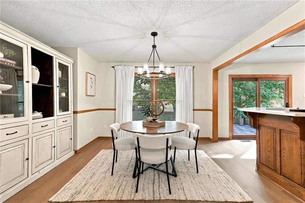Open floor plan and statement lighting at 15205 Lamar Avenue, Overland Park, KS 66223