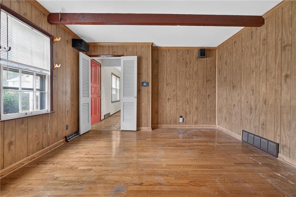 Hardwood floors, shiplap / paneling and ceiling beams at 5701 W 97th Terrace, Overland Park, KS 66207
