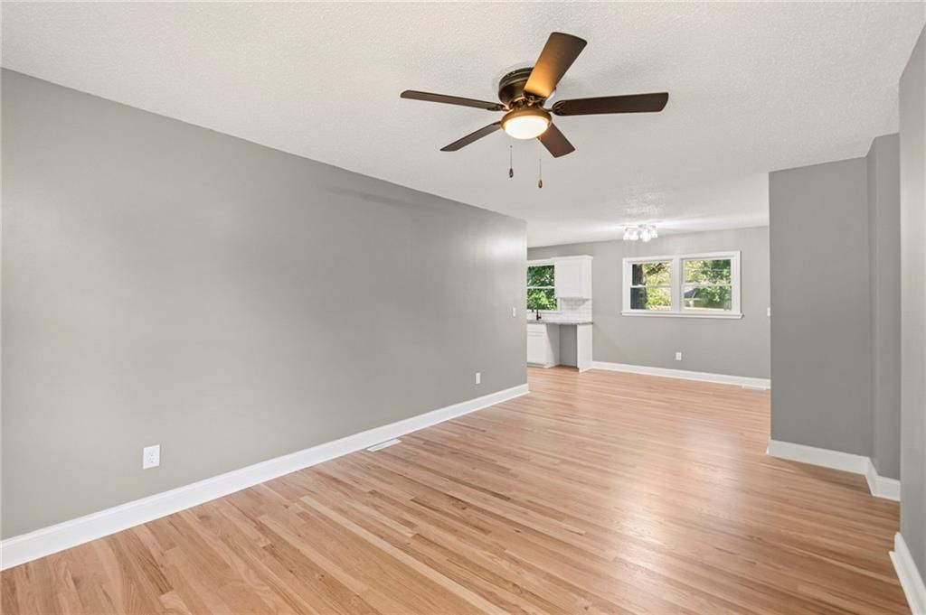 Open floor plan, hardwood floors and white trim at 11911 Fremont Avenue, Grandview, MO 64030