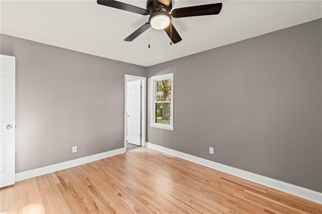 Main-floor primary bedroom at 11911 Fremont Avenue, Grandview, MO 64030