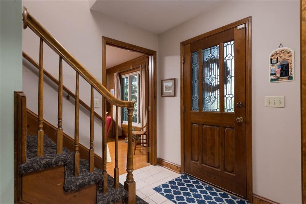 Staircase and wood stair railing at 719 White Oak Lane, Gladstone, MO 64116
