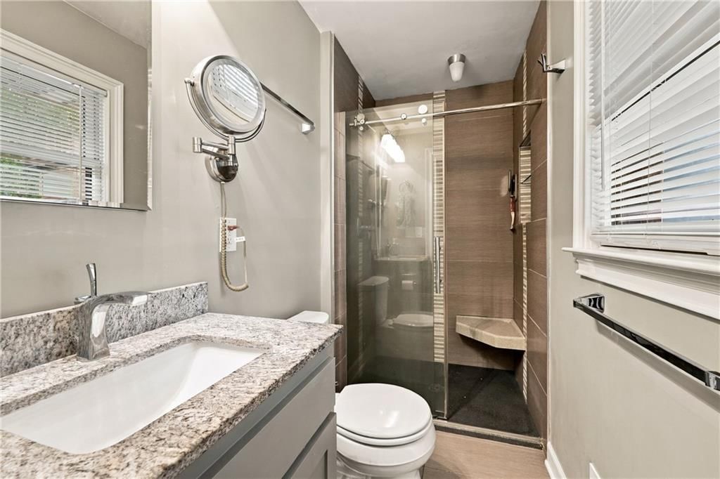 Walk-in shower, tiled shower and frameless glass shower at 1703 NE 77 Street, Gladstone, MO 64118
