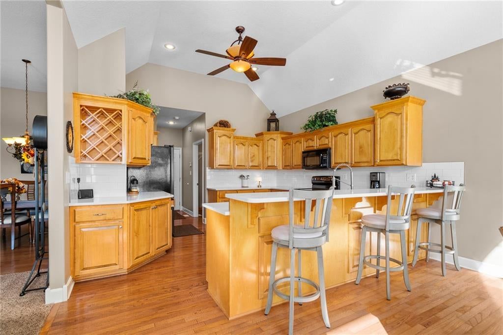 Kitchen backsplash at 207 Peach Tree Avenue, Lone Jack, MO 64070