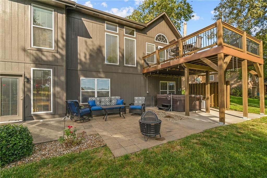 Pond or creek visible on the lot, deck and big backyard at 207 Peach Tree Avenue, Lone Jack, MO 64070