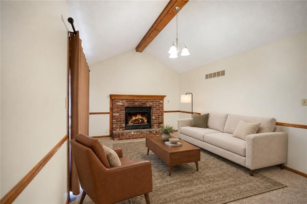Tall ceilings, fireplace and ceiling beams at 5511 NE 50th Street, Kansas City, MO 64119