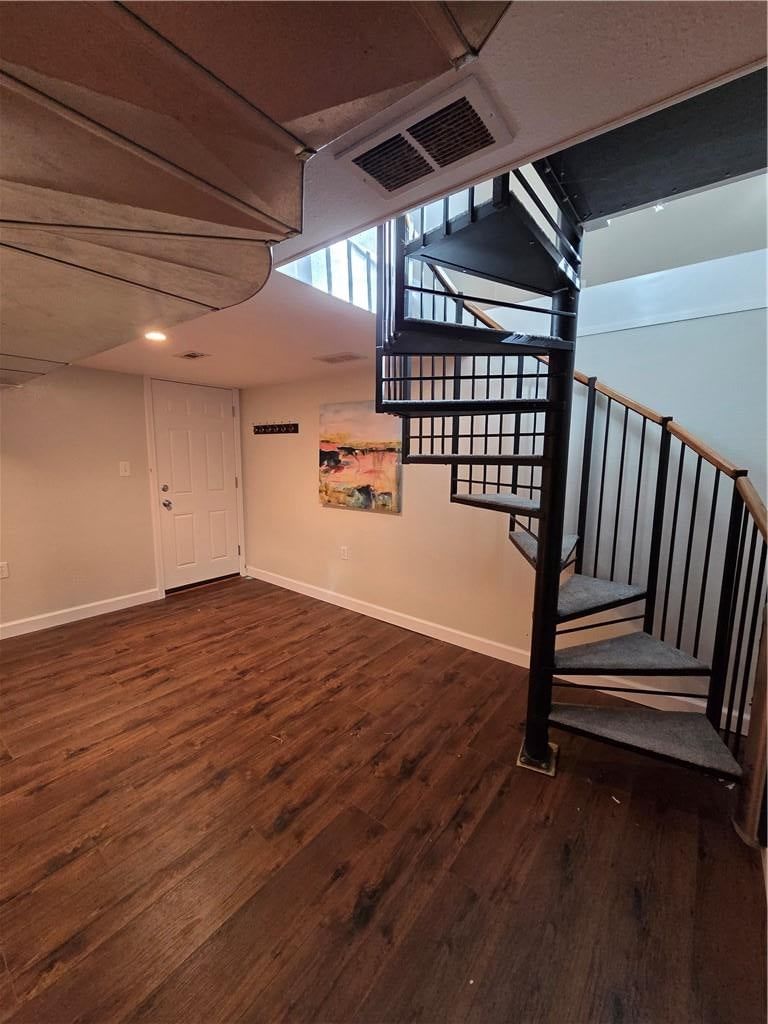 Curved staircase, staircase and iron stair railing at 10911 W 56th Street, Shawnee, KS 66203