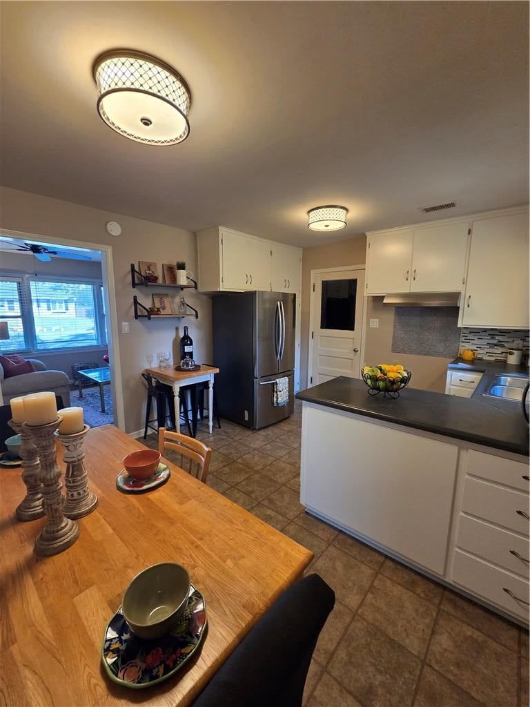 Open floor plan and stainless steel appliances at 10911 W 56th Street, Shawnee, KS 66203