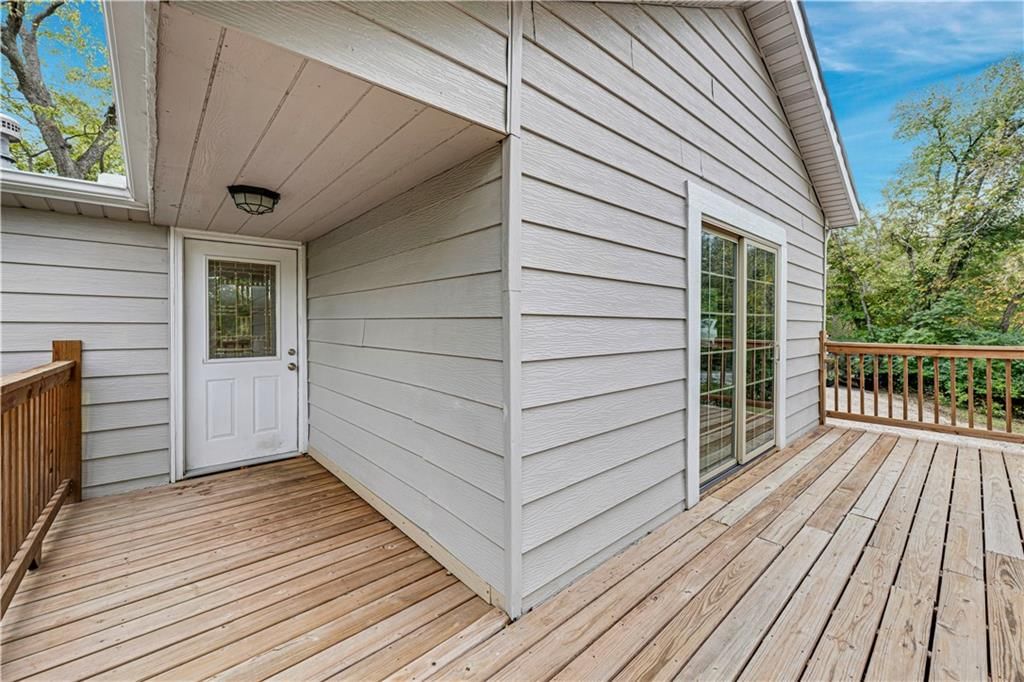 Covered patio at 165 T Street, Lake Lotawana, MO 64086
