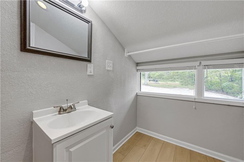 Tiled shower and tub and shower combo at 165 T Street, Lake Lotawana, MO 64086