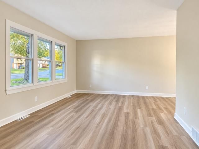 Luxury vinyl floors, white trim and beige walls at 7503 E 93rd Street, Kansas City, MO 64138