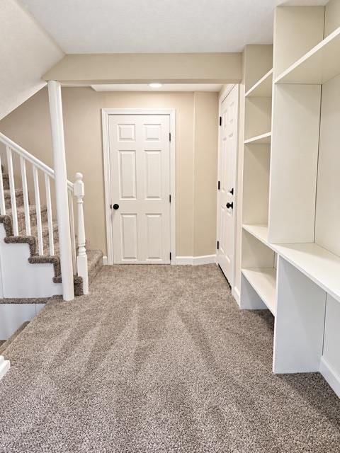 Wood stair railing and black hardware at 7503 E 93rd Street, Kansas City, MO 64138