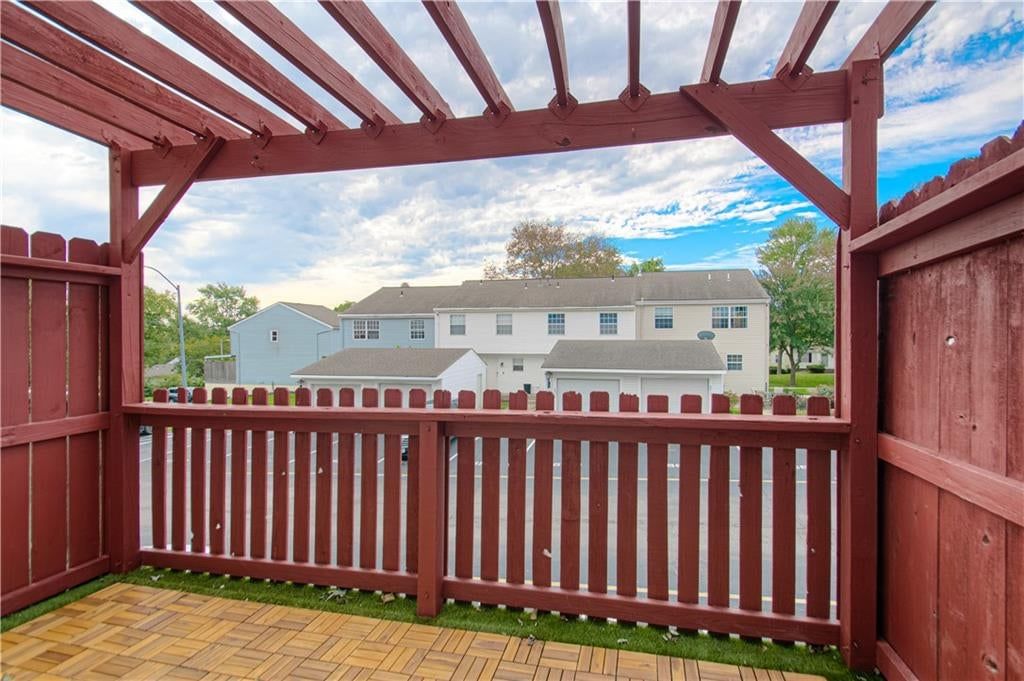 Deck, pergola and fenced yard at 6616 E 128th Street, Grandview, MO 64030