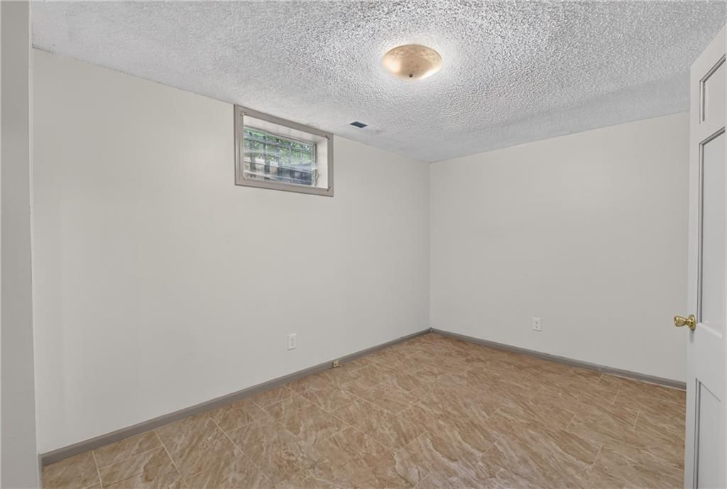 Tile floors and staircase at 4013 Springfield Street, Kansas City, KS 66103