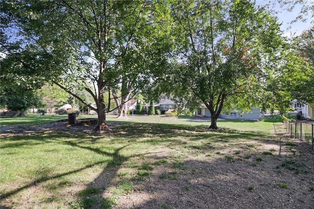 Big backyard, fenced yard and mature trees at 3012 S Norwood Avenue S, Independence, MO 64052