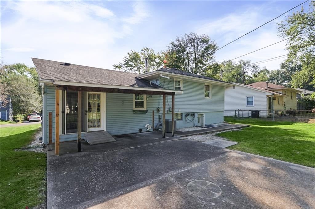 Covered patio and concrete patio at 3012 S Norwood Avenue S, Independence, MO 64052