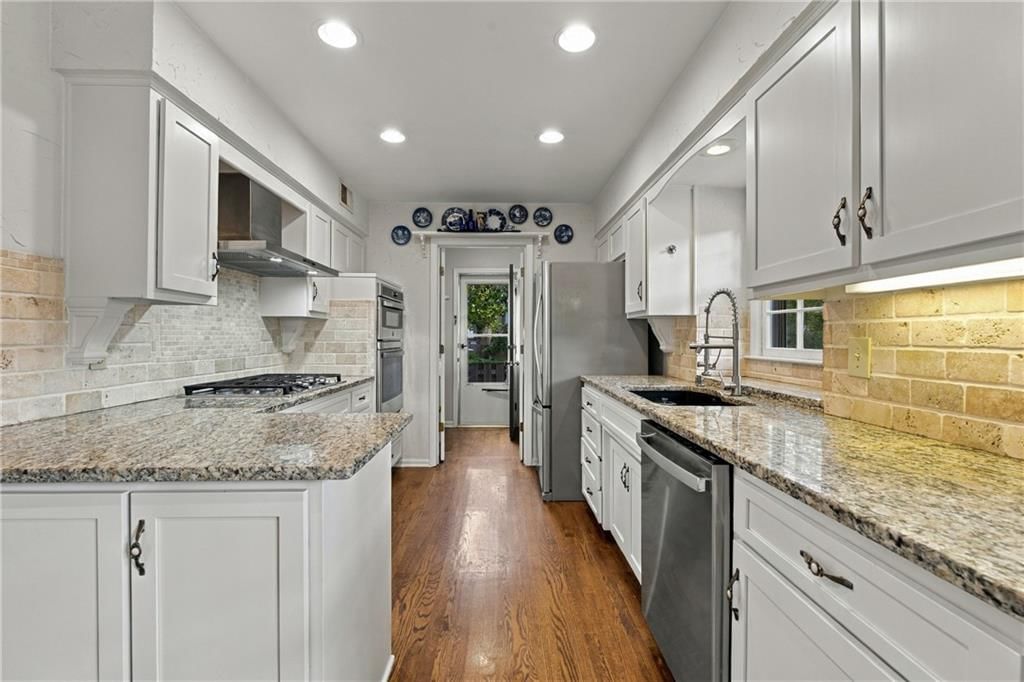 Gas range, double oven and stainless steel appliances at 9320 W 113th Street, Overland Park, KS 66210