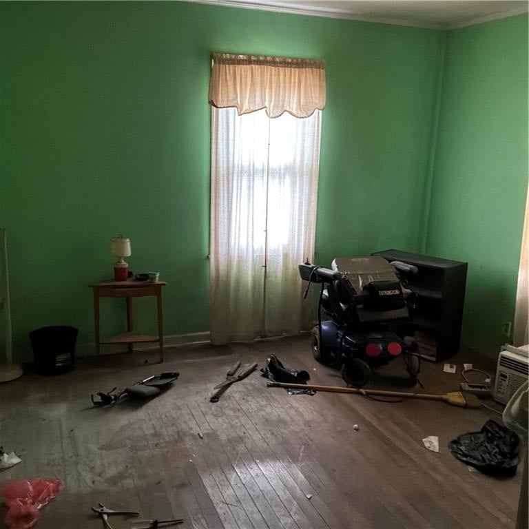 Hardwood floors and green walls at 2743 31 Street N, Kansas City, KS 66104
