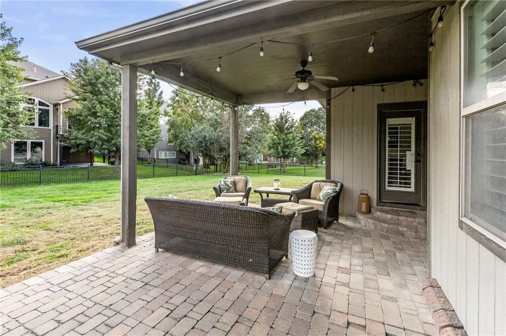 Fenced yard, paver patio and covered patio at 9411 W 163rd Terrace, Overland Park, KS 66085