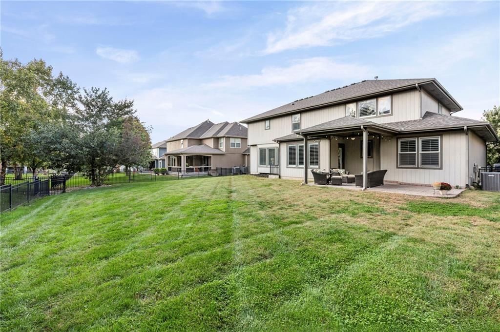 Big backyard and mature trees at 9411 W 163rd Terrace, Overland Park, KS 66085