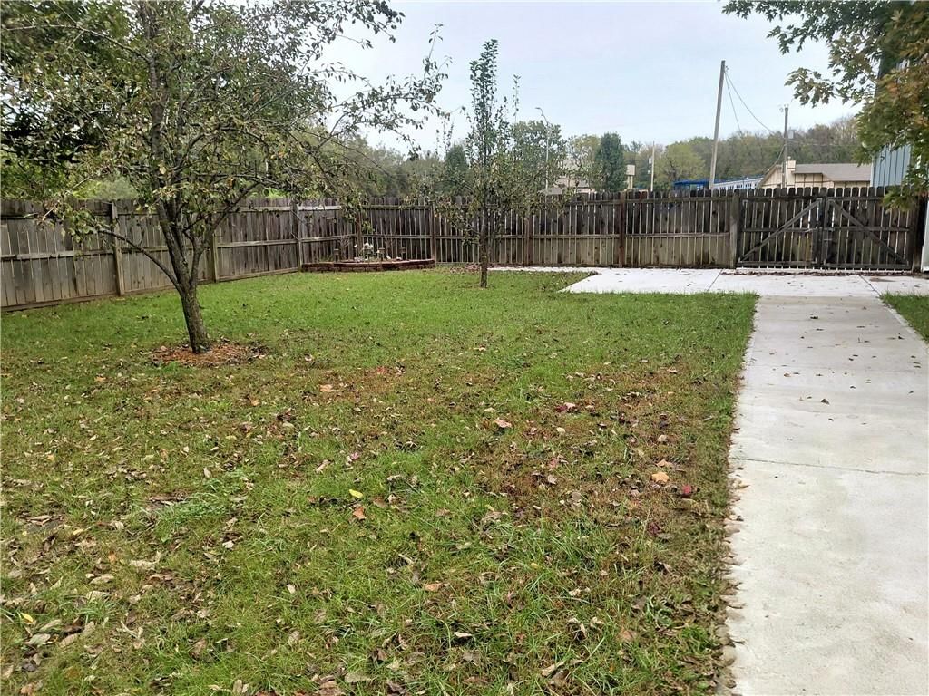 Big backyard, fenced yard and mature trees at 10010 James A Reed Road, Kansas City, MO 64134