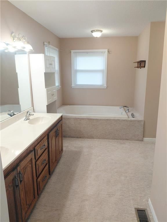 Double vanity at 10010 James A Reed Road, Kansas City, MO 64134