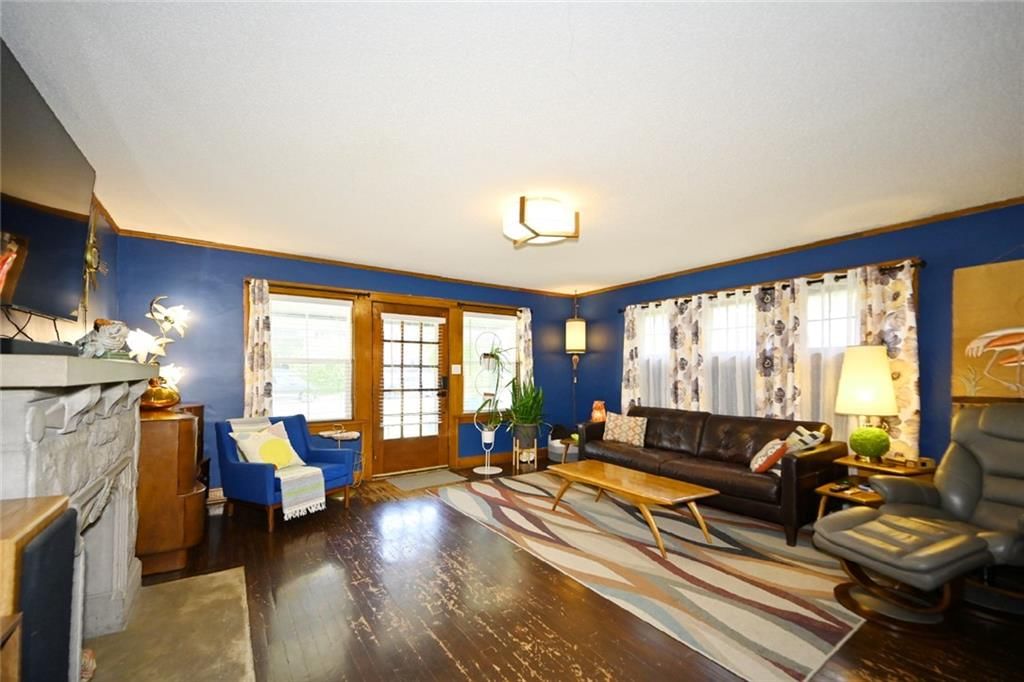 Fireplace, white trim and accent wall at 4116 Adams Street, Kansas City, KS 66103