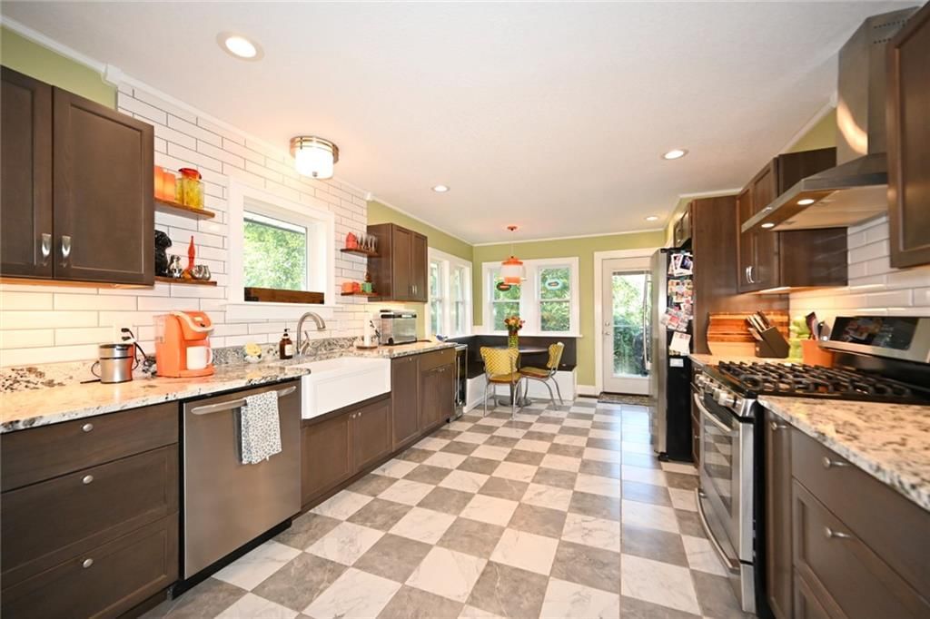 Open floor plan, breakfast nook and updated kitchen at 4116 Adams Street, Kansas City, KS 66103
