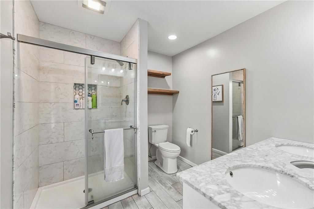Walk-in shower, double vanity and frameless glass shower at 14315 W 65th Street, Shawnee, KS 66216