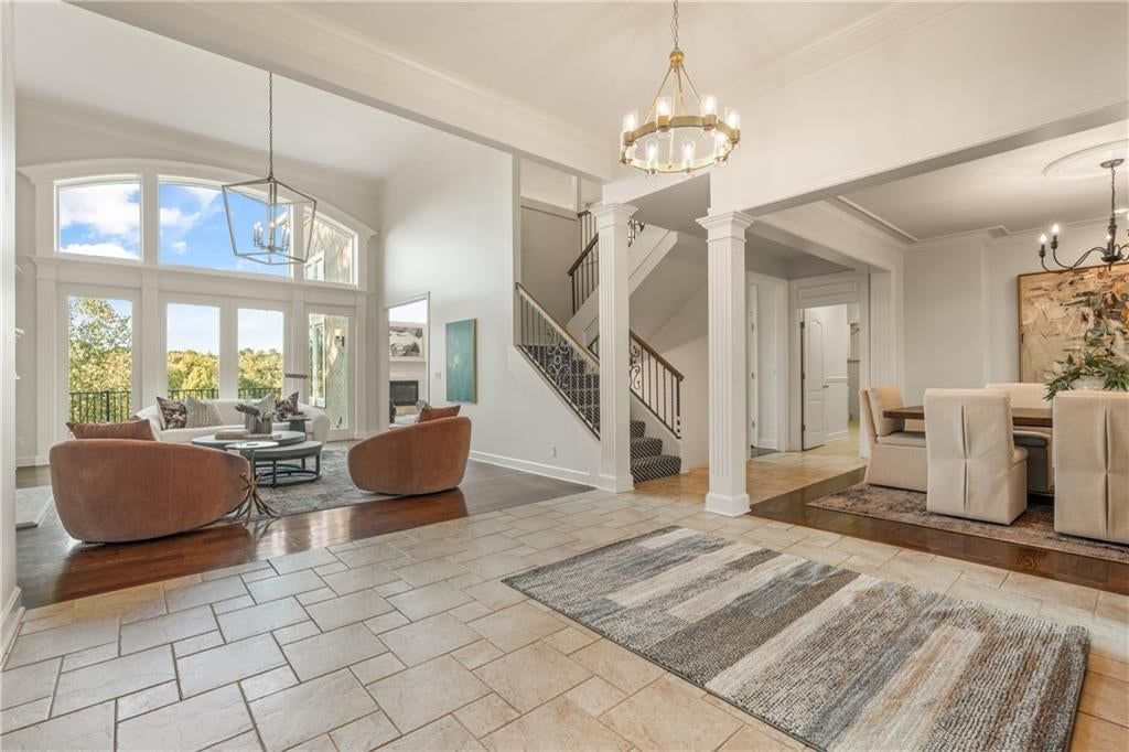 Hardwood floors, statement lighting and staircase at 3608 W 153rd Street, Leawood, KS 66224
