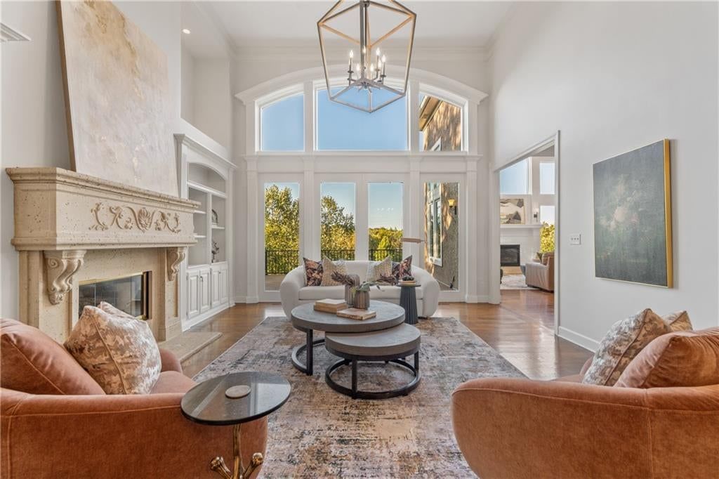 Tall ceilings, fireplace and floor-to-ceiling windows at 3608 W 153rd Street, Leawood, KS 66224