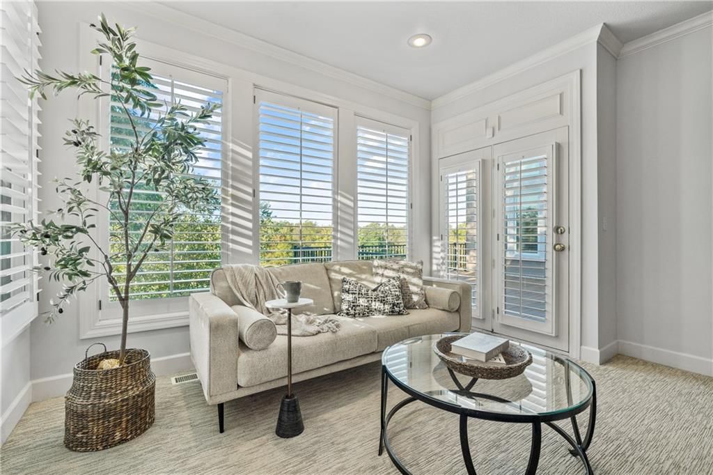 Main-floor primary bedroom, tray ceiling and bedroom sitting area at 3608 W 153rd Street, Leawood, KS 66224