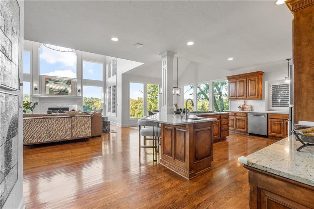 Open floor plan, kitchen island and quartz counters at 3608 W 153rd Street, Leawood, KS 66224