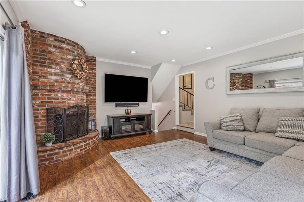 Fireplace and exposed brick wall at 14513 90TH Court, Lenexa, KS 66215