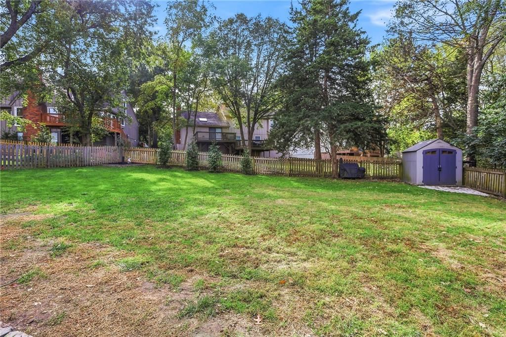 Big backyard, fenced yard and mature trees at 14513 90TH Court, Lenexa, KS 66215