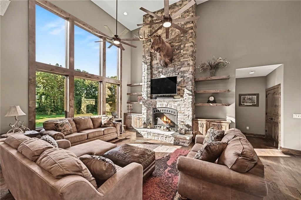 Fireplace, floor-to-ceiling windows and wall of windows at 12924 Jacob Lane, Kearney, MO 64060