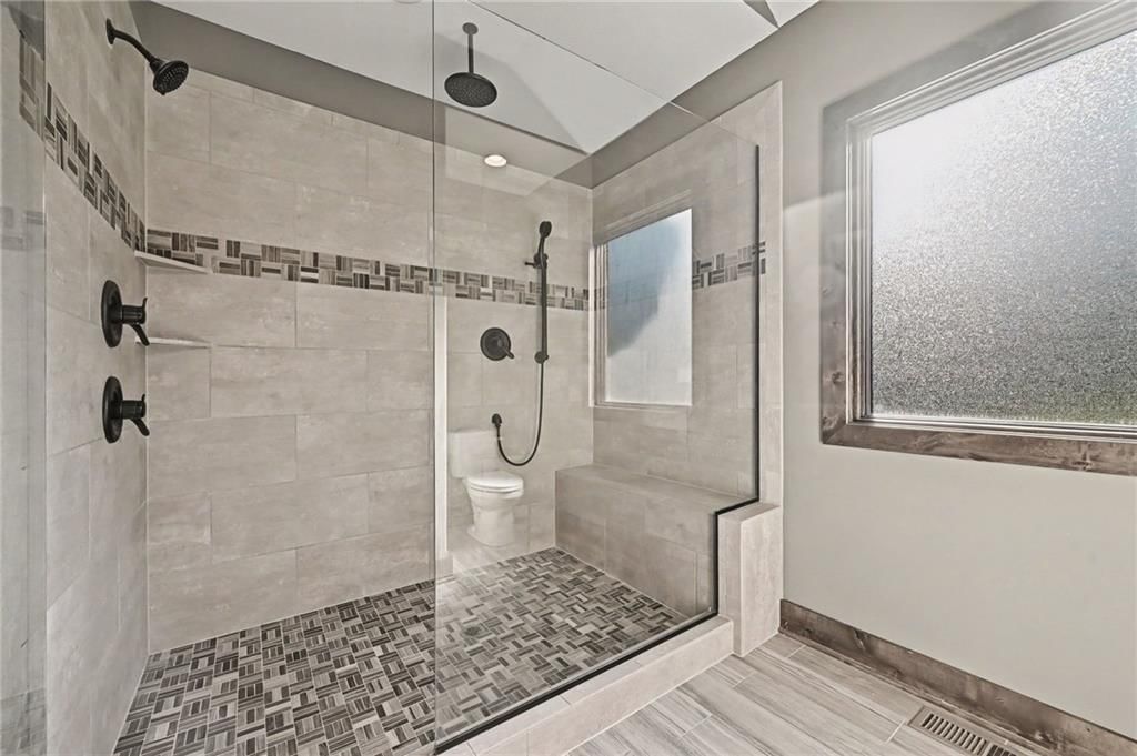 Walk-in shower, tiled shower and frameless glass shower at 12924 Jacob Lane, Kearney, MO 64060