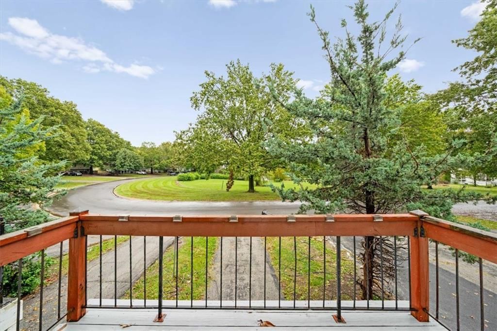 Mature trees, attached garage and flat lot at 8727 Sycamore Avenue, Kansas City, MO 64138