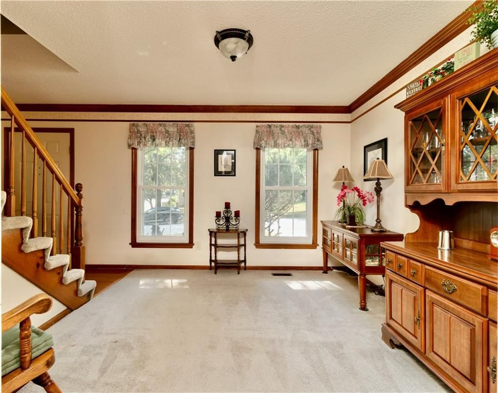 Staircase, wood stair railing and white trim at 15800 W 125th Terrace, Olathe, KS 66062