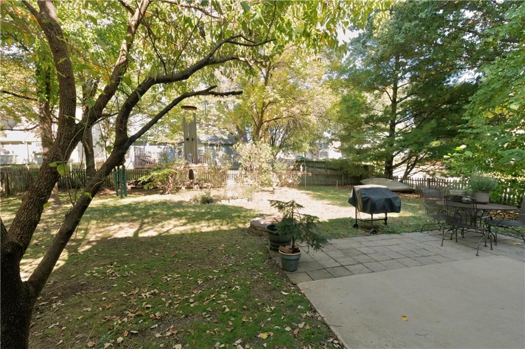 Big backyard, fenced yard and mature trees at 15800 W 125th Terrace, Olathe, KS 66062