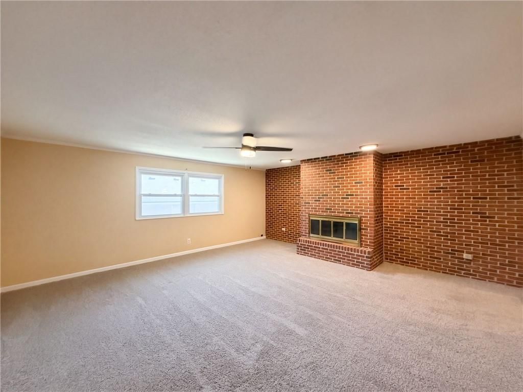 Fireplace and exposed brick wall at 602 W 101st Street, Kansas City, MO 64114