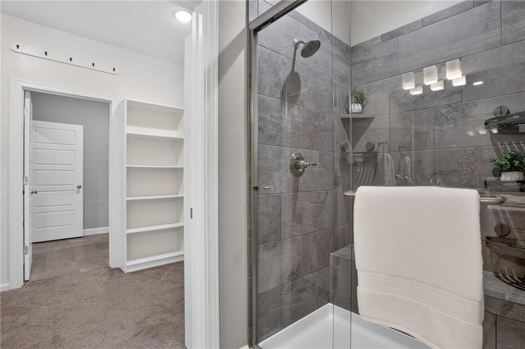 Walk-in shower and tiled shower at 21421 E 32nd Terrace S, Independence, MO 64057