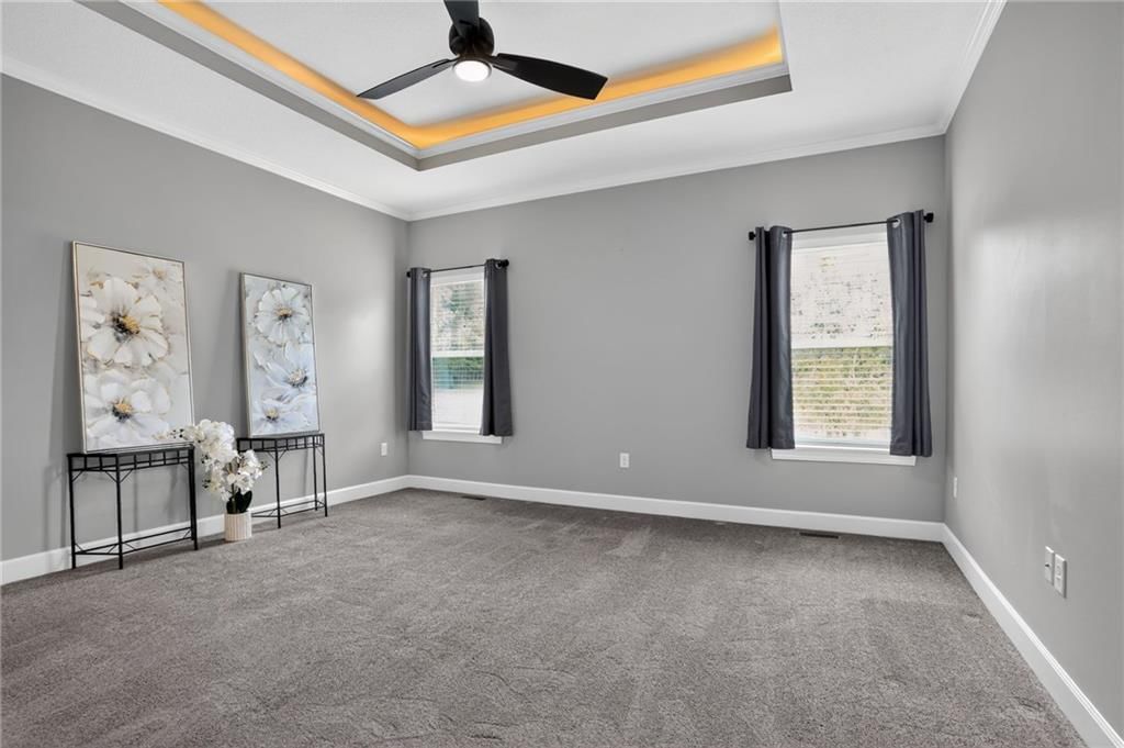 Main-floor primary bedroom at 21421 E 32nd Terrace S, Independence, MO 64057