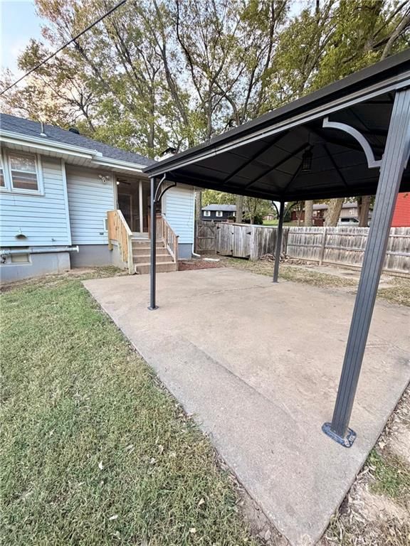 Covered patio and concrete patio at 3831 S Kiger Road, Independence, MO 64055