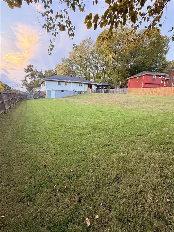 Big backyard, fenced yard and mature trees at 3831 S Kiger Road, Independence, MO 64055